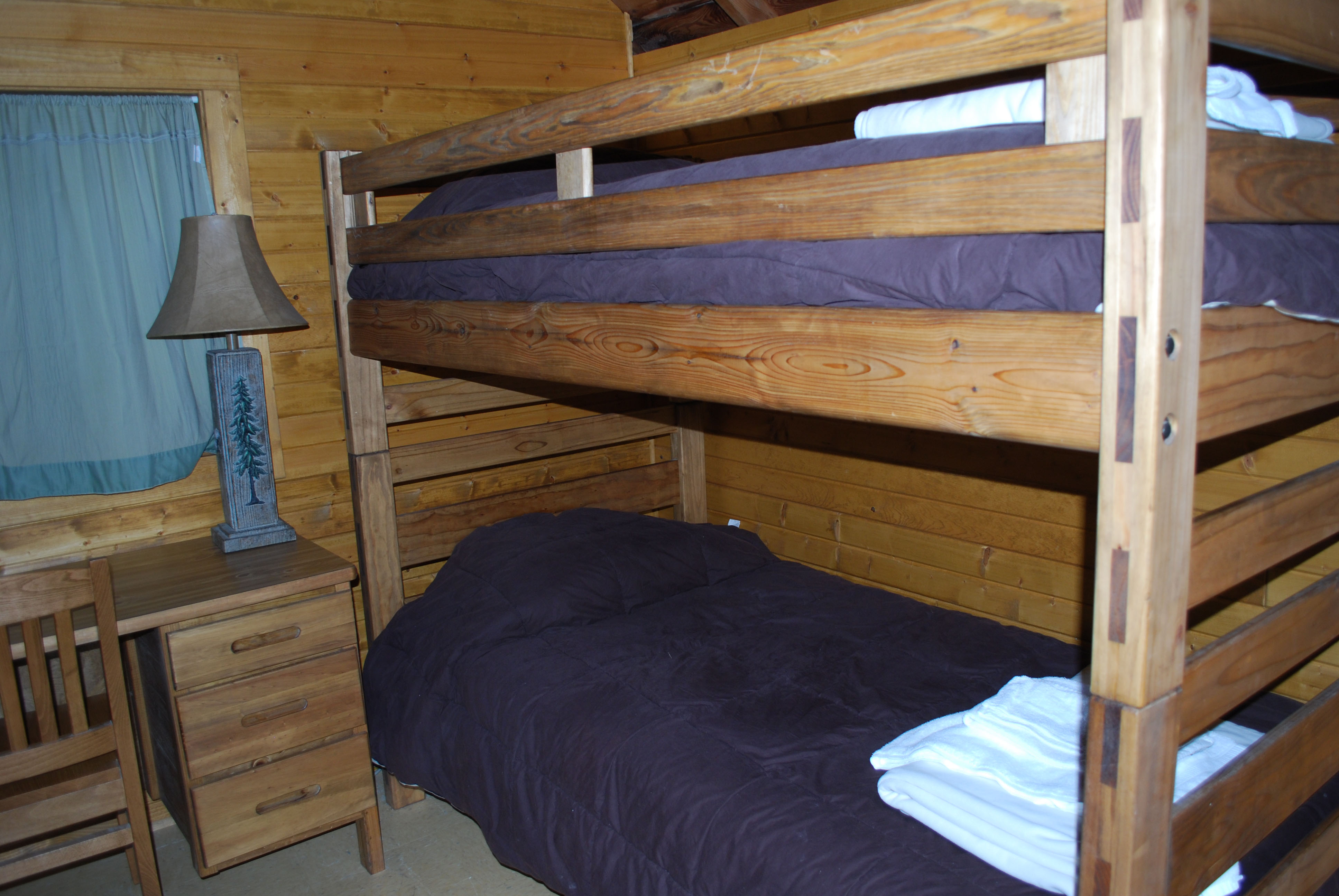 Inside of cabin on the hill room with bunkbeds