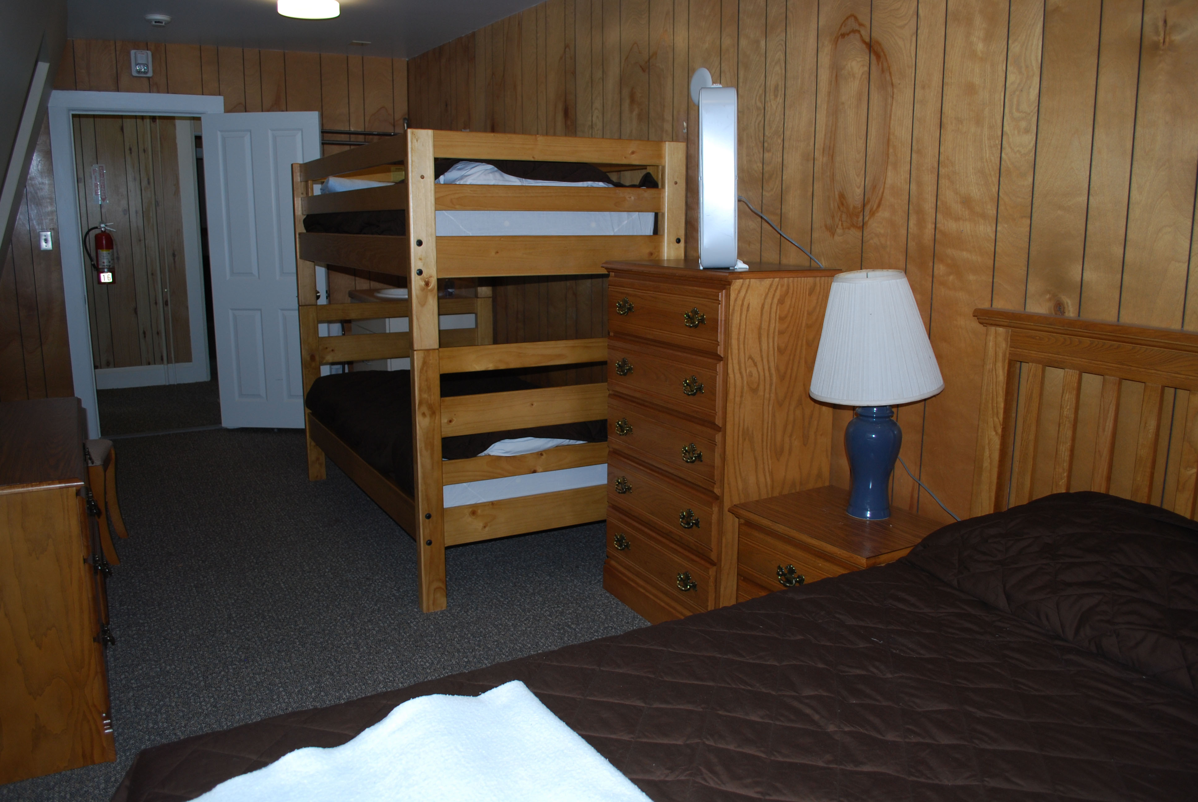 Inside of inn room with bunkbeds from another angle